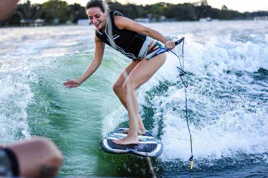 wakeboard behind a pontoon